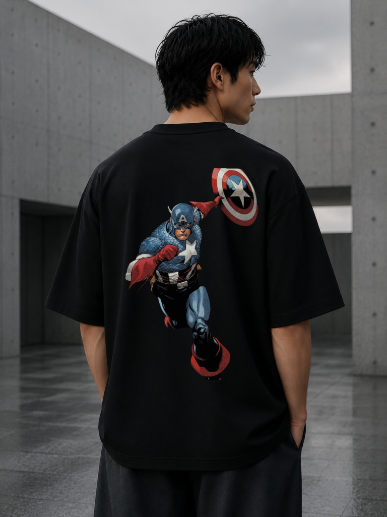 Model wearing black oversized graphic t-shirt with Valor Shield artwork on the back
